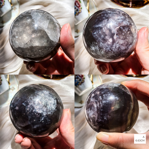 Four views of a fluorite sphere with dark purple bandings and plenty of sparkly mica inclusions ball held in a hand against a blurred background.