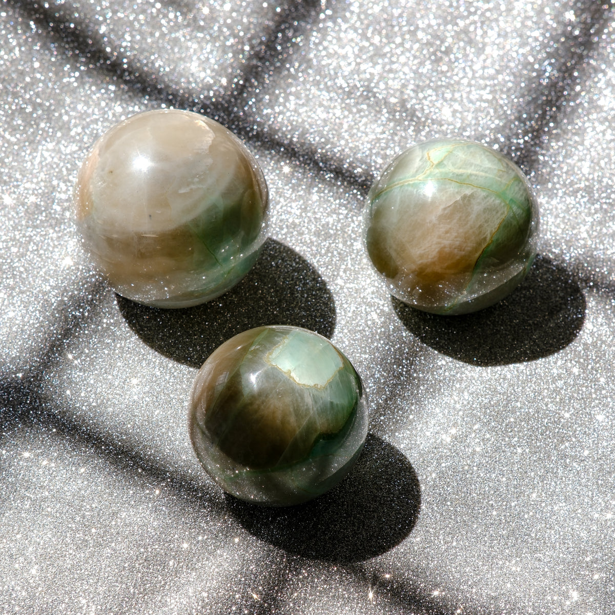 Garnierite Green Moonstone or False Jade spheres which exhibit gorgeous translunceny and plenty of sheen.