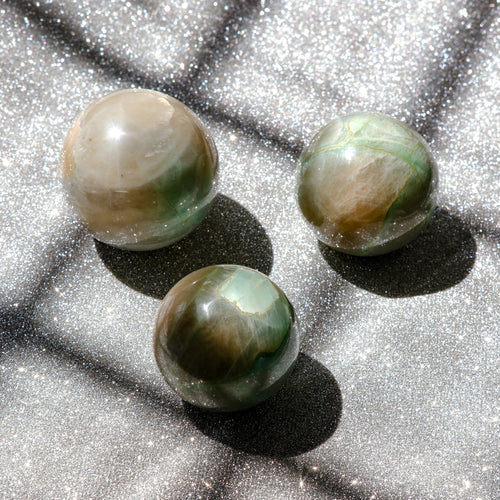 Garnierite Green Moonstone or False Jade spheres which exhibit gorgeous translunceny and plenty of sheen.