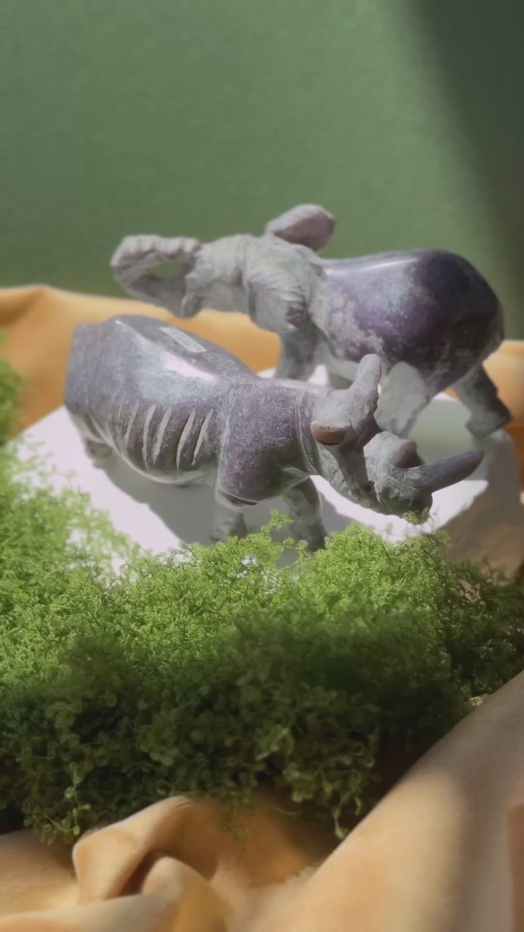 video of intricate and lifelike carvings of lepidolite stone into savannah animals