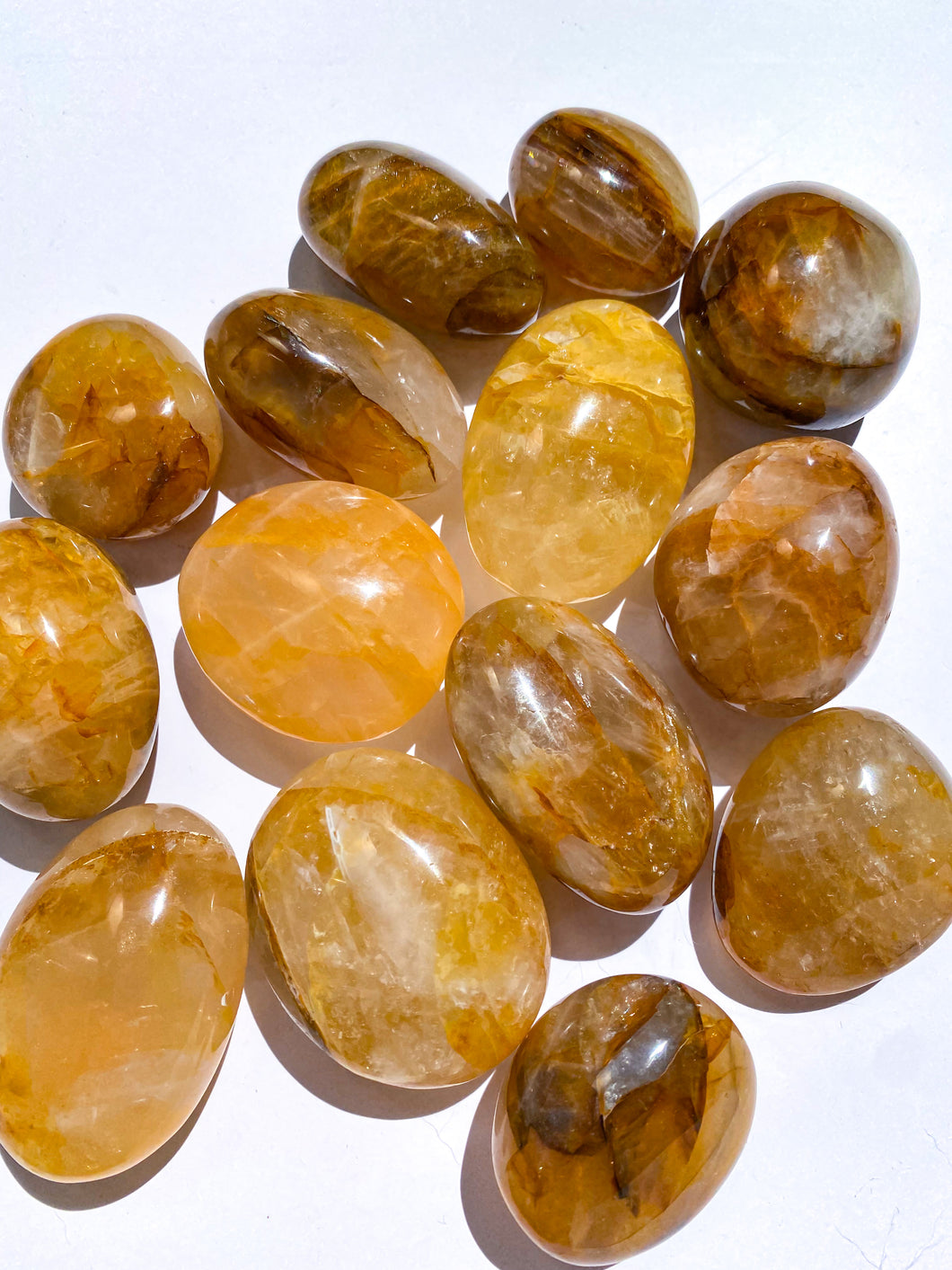 Golden Healer Yellow Hematoid Quartz Palm Stones from Brazil