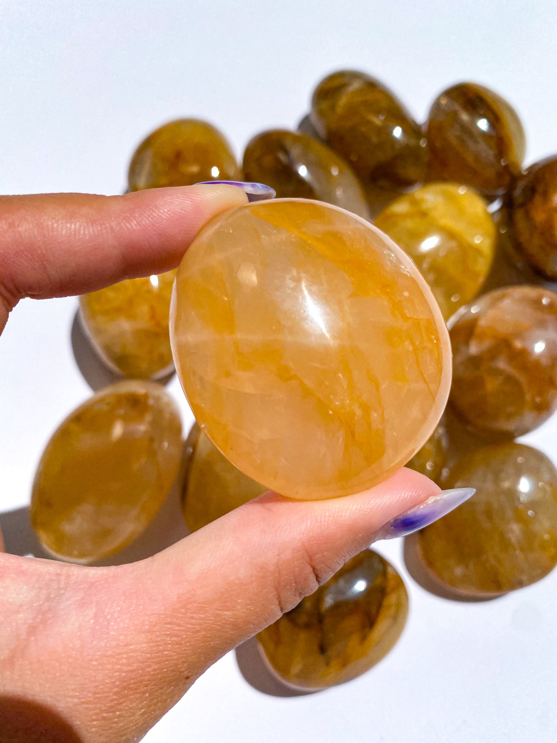Golden Healer Yellow Hematoid Quartz Palm Stones from Brazil